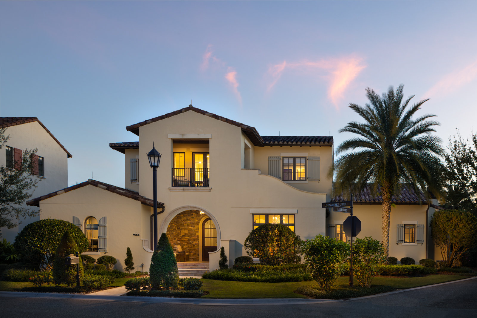 front of home with beige paint and mediterranean design